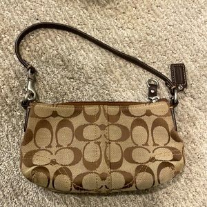 Brown coach wristlet.